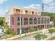 Beautiful brick building with large arched windows and ground-level covered parking at 112 Rogers Ne St # 206, Atlanta, GA 30317