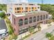 Striking building exterior featuring brick facade, arched windows, rooftop deck and modern architectural design at 112 Rogers Ne St # 206, Atlanta, GA 30317