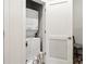 A laundry closet with a stacked washer and dryer, and storage space for laundry supplies, providing convenience at 112 Rogers Ne St # 206, Atlanta, GA 30317