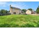Expansive backyard with lush green grass, bordered by a wooden fence at 2586 Abbotts Glen Dr, Acworth, GA 30101