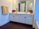 Bathroom with a double sink vanity with white cabinets and granite countertops at 2586 Abbotts Glen Dr, Acworth, GA 30101