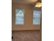 Bright bedroom features neutral walls, carpet, and a ceiling fan at 2586 Abbotts Glen Dr, Acworth, GA 30101