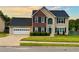 Charming two-story home featuring a brick accent, attached garage, and well-manicured lawn at 2586 Abbotts Glen Dr, Acworth, GA 30101