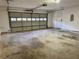 Spacious two-car garage with an automatic door and clean concrete flooring at 2586 Abbotts Glen Dr, Acworth, GA 30101