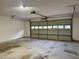 Large two-car garage with concrete flooring, ample space, and an automatic door at 2586 Abbotts Glen Dr, Acworth, GA 30101