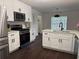 Bright kitchen featuring stainless steel appliances, white cabinets and countertop island at 2586 Abbotts Glen Dr, Acworth, GA 30101