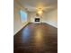 Spacious living room featuring wood floors, a fireplace, and large windows at 2586 Abbotts Glen Dr, Acworth, GA 30101