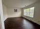 Spacious room featuring hardwood floors and a large window at 2586 Abbotts Glen Dr, Acworth, GA 30101