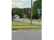 Quiet residential street scene showcasing a corner lot with a house and a stop sign at 2586 Abbotts Glen Dr, Acworth, GA 30101