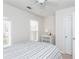 Bright bedroom with two windows, striped bedding, neutral carpet and white dresser at 2826 Loftview Sq # 4, Atlanta, GA 30339