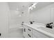 Bathroom showcasing double sink vanity and tub with shower at 3555 New Hope Rd, Dacula, GA 30019