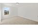 Bedroom featuring a large window, plush carpet, and bright white walls at 3555 New Hope Rd, Dacula, GA 30019