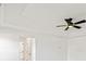 Detailed tray ceiling with black ceiling fan providing ample lighting at 3555 New Hope Rd, Dacula, GA 30019