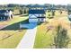 Inviting two-story home featuring a manicured lawn and a long driveway at 3555 New Hope Rd, Dacula, GA 30019