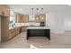 Stylish kitchen with a center island, stainless steel appliances, and light wood cabinets at 3555 New Hope Rd, Dacula, GA 30019