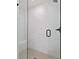 Contemporary walk-in shower with marble-like tile and modern fixtures at 3555 New Hope Rd, Dacula, GA 30019