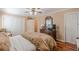 Spacious bedroom with hardwood floors, ceiling fan, and a closet at 731 Pine Valley Rd, Mableton, GA 30126