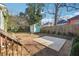 View of the backyard featuring a shed, a concrete pad, and a wooden fence at 1474 Athens Avenue Sw Ave, Atlanta, GA 30310
