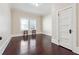 A well lit bedroom with hardwood floors and two windows at 1474 Athens Avenue Sw Ave, Atlanta, GA 30310