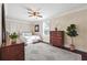 This main bedroom is filled with natural light and features a large dresser and hardwood floors at 1474 Athens Avenue Sw Ave, Atlanta, GA 30310