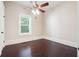 This bedroom features dark wood floors, ceiling fan and bright natural light at 1474 Athens Avenue Sw Ave, Atlanta, GA 30310