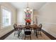 Traditional dining room with hardwood floors, a chandelier and bright natural light at 1474 Athens Avenue Sw Ave, Atlanta, GA 30310