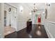 Elegant hallway with dark wood floors, wainscoting, and views into adjoining rooms at 1474 Athens Avenue Sw Ave, Atlanta, GA 30310