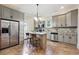 Stylish kitchen with stainless steel appliances, gray cabinets, and a functional center island at 1474 Athens Avenue Sw Ave, Atlanta, GA 30310