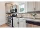 Modern kitchen with stainless steel appliances and tiled backsplash at 1474 Athens Avenue Sw Ave, Atlanta, GA 30310