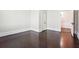 Neutral colored room featuring dark wood floors, white trim and natural light at 1474 Athens Avenue Sw Ave, Atlanta, GA 30310