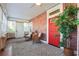 Charming sunroom featuring brick walls, a stained glass window, and comfortable seating at 1474 Athens Avenue Sw Ave, Atlanta, GA 30310