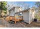 Tan two-story home featuring a wooden deck, sliding glass doors, and an AC unit at 170 Charlotte Blvd, Stockbridge, GA 30281