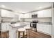 Modern kitchen featuring white cabinets, stainless steel appliances, and granite countertops at 170 Charlotte Blvd, Stockbridge, GA 30281
