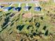 Aerial view of the empty lot for sale bordered by houses and natural landscape at 3563 New Hope Rd, Dacula, GA 30019