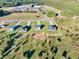 Aerial view of a lot for sale and neighboring houses in a residential neighborhood at 3563 New Hope Rd, Dacula, GA 30019