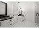 Bright bathroom featuring double vanities with modern fixtures and a glass-enclosed shower at 3563 New Hope Rd, Dacula, GA 30019