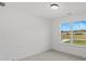 Bright bedroom with large window offering scenic views of the neighborhood at 3563 New Hope Rd, Dacula, GA 30019