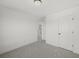 Clean, carpeted bedroom with white walls and a large closet for ample storage at 3563 New Hope Rd, Dacula, GA 30019