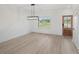 Dining area with wood floors, natural light, and stylish modern lighting at 3563 New Hope Rd, Dacula, GA 30019