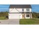 Beautiful two-story house with a well-kept lawn and a large garage at 3563 New Hope Rd, Dacula, GA 30019