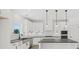 Bright kitchen featuring white cabinets, granite countertops, and stainless steel appliances at 3563 New Hope Rd, Dacula, GA 30019