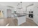 Bright kitchen with white cabinets, granite countertops, and stainless steel appliances at 3563 New Hope Rd, Dacula, GA 30019