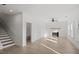 Spacious living room with light wood floors, a fireplace, and ample natural light at 3563 New Hope Rd, Dacula, GA 30019