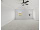 Bright main bedroom with a tray ceiling, carpet, and large windows at 3563 New Hope Rd, Dacula, GA 30019
