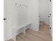 Convenient mudroom with built-in bench and storage, adjacent to a half bathroom at 3563 New Hope Rd, Dacula, GA 30019