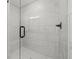 A close-up of the tiled shower showcasing its glass door and modern fixtures at 3563 New Hope Rd, Dacula, GA 30019
