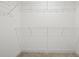 Empty walk-in closet with white wire shelving, providing ample storage space at 3563 New Hope Rd, Dacula, GA 30019