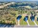 Aerial view of a modern homesite in a lush, green community with tree coverage at 3567 New Hope Rd, Dacula, GA 30019