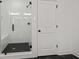 Walk-in shower with glass door and sleek black fixtures at 3567 New Hope Rd, Dacula, GA 30019