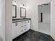 Double vanity bathroom with granite countertops and framed mirrors at 3567 New Hope Rd, Dacula, GA 30019
